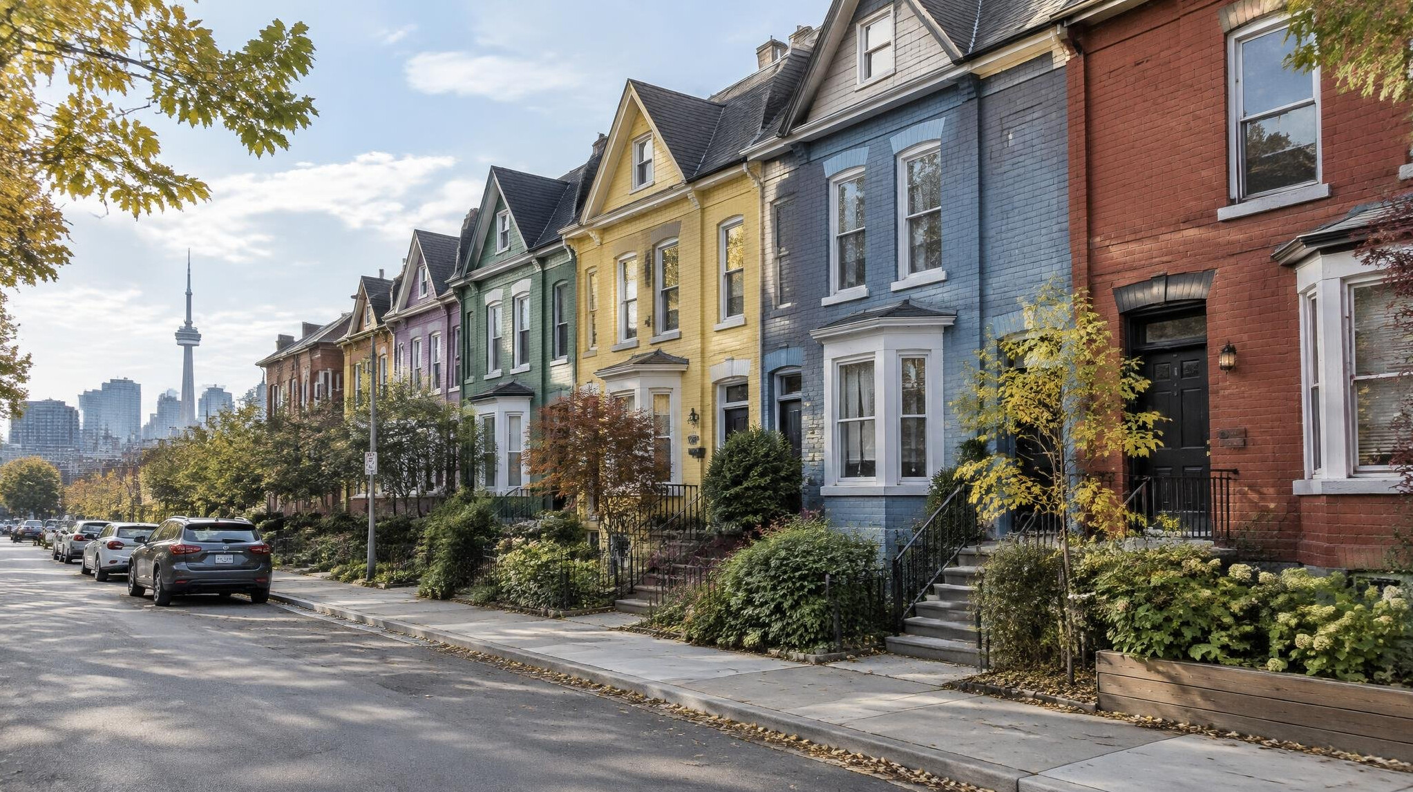 Row of colourful attached houses on a residential street