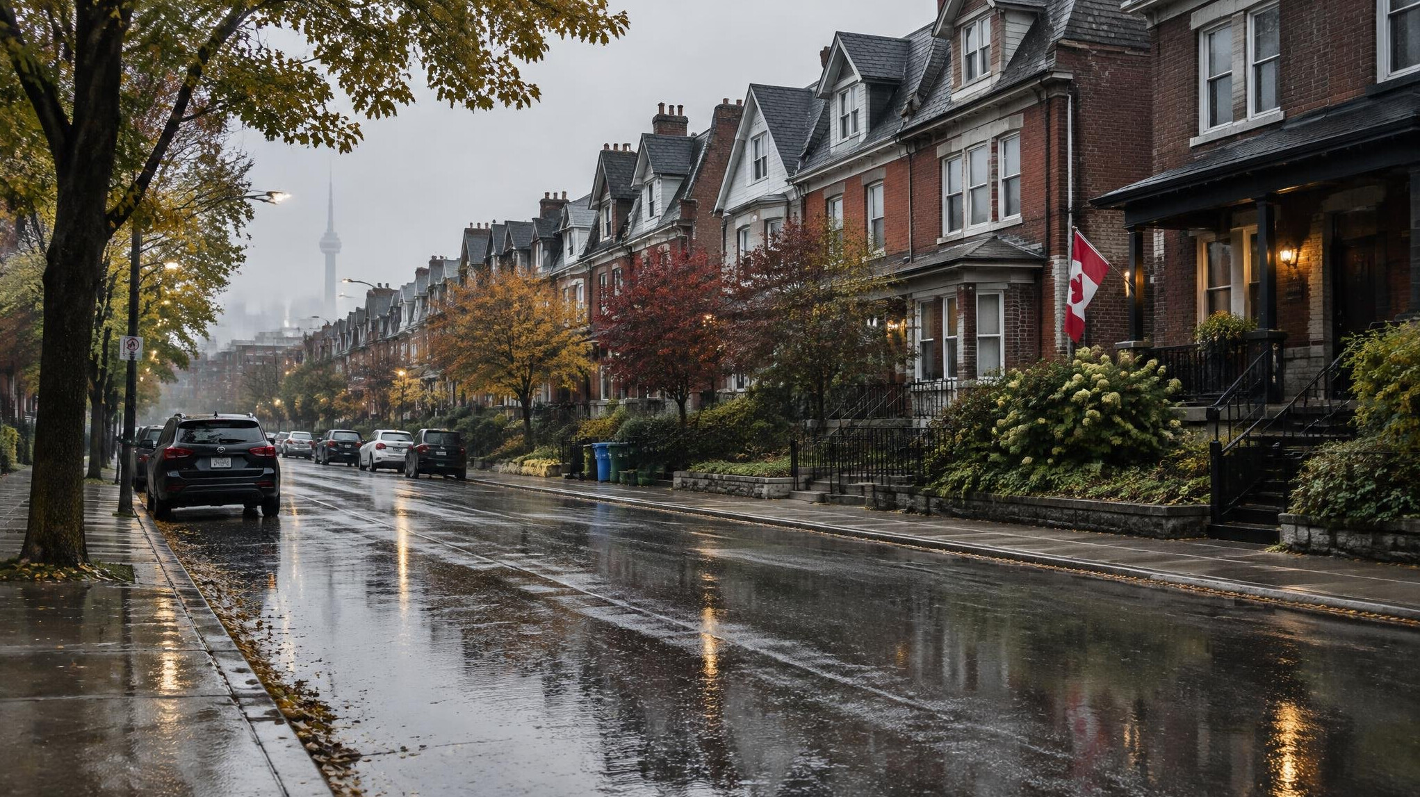A quiet residential street of row houses under a rainy sky