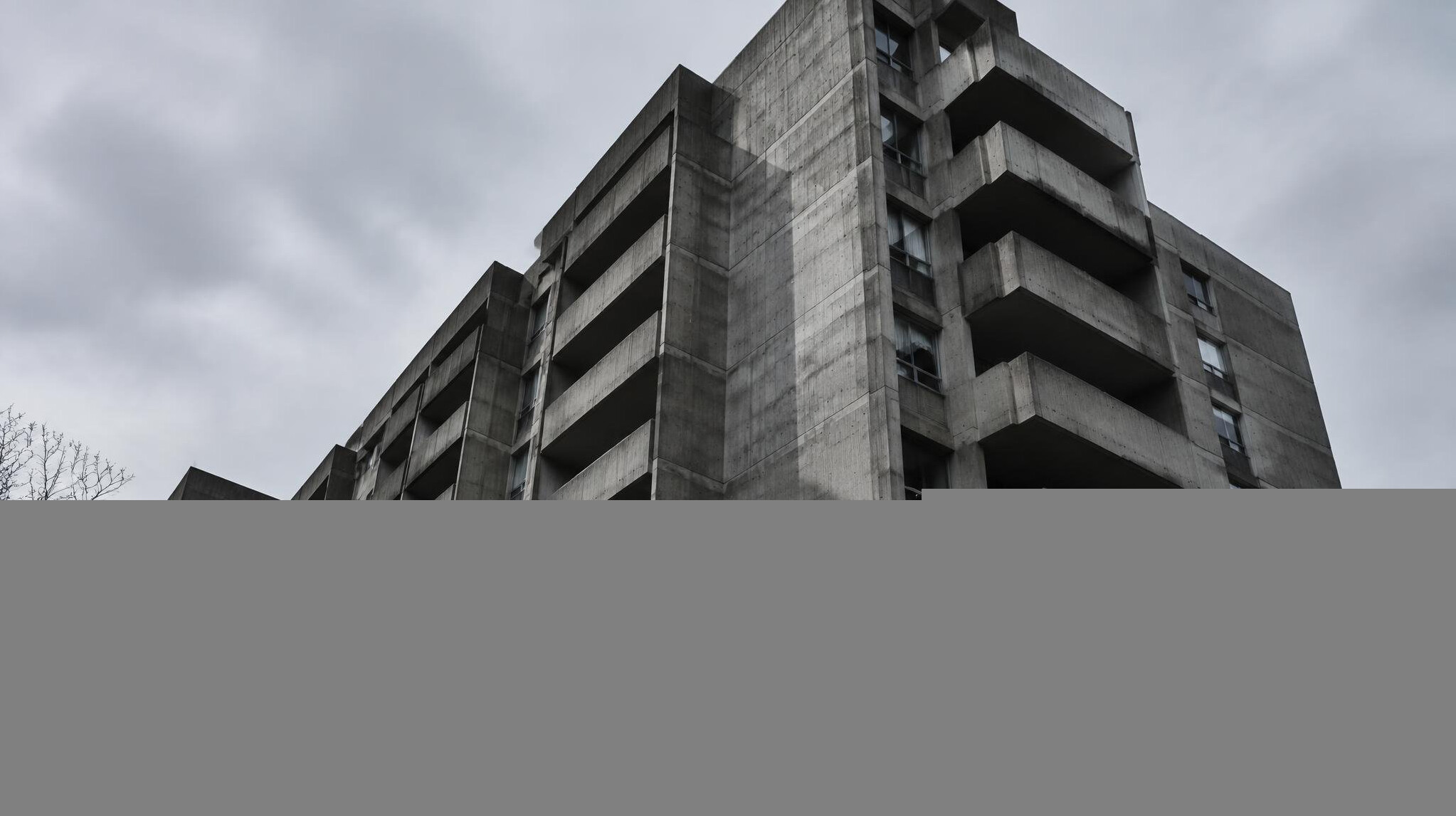 Low angle view of a concrete apartment building facade