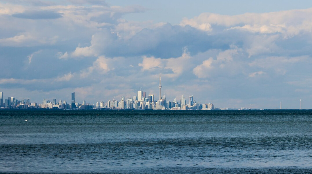Overcast skyline of a Canadian city seen from across the water