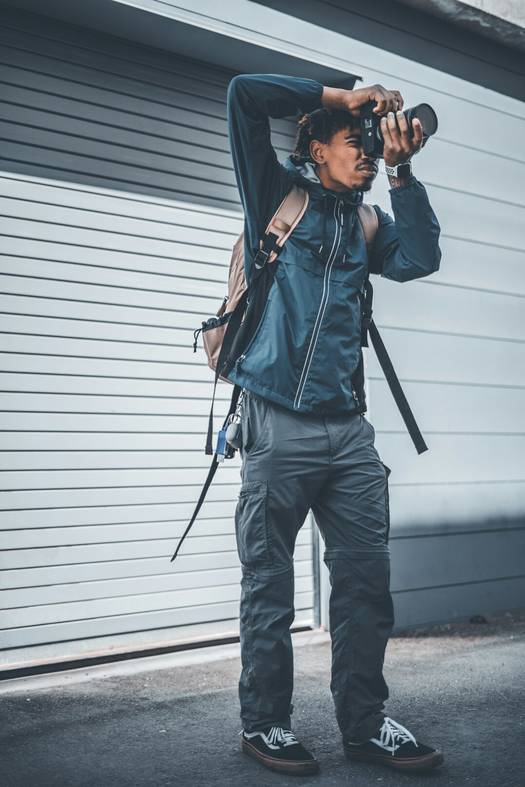 Studio portrait of an East Asian man urban explorer photographer
